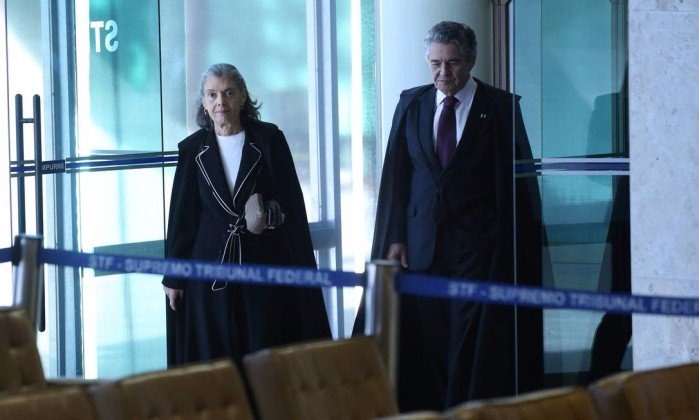 Marco Aurélio determina volta de Aécio Neves ao Senado Os ministros Cármen Lúcia e Marco Aurélio de Melo entram par a última sessão no plenário do STF antes do recesso - Ailton de Freitas / O Globo